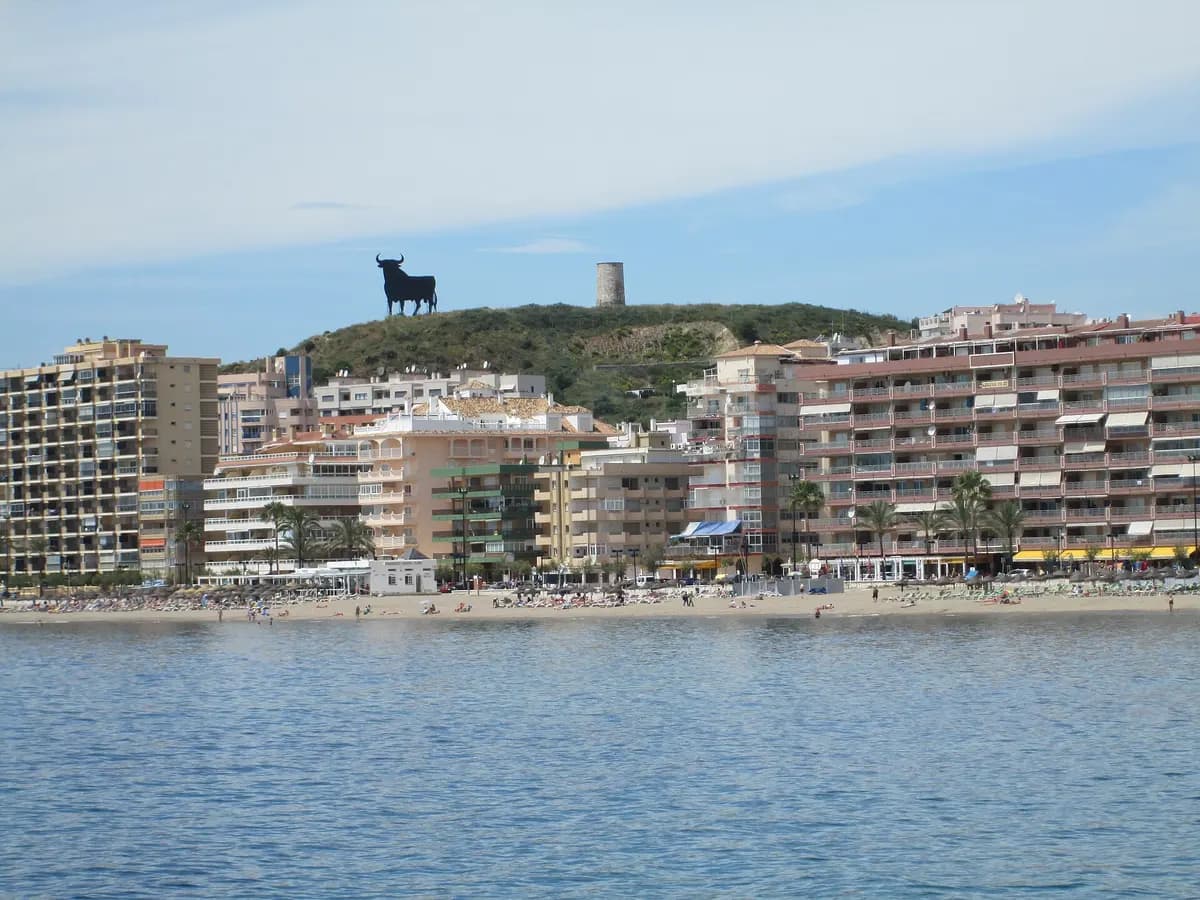 Playa de Torreblanca, with the Osborne bull on the hill above